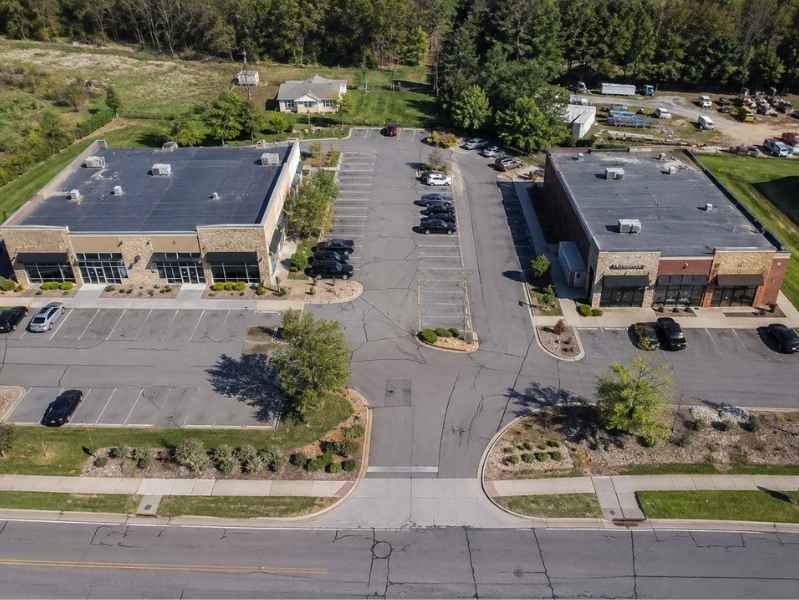 ALTA survey showing shared parking areas and parcel boundaries for a commercial property in Pensacola Florida
